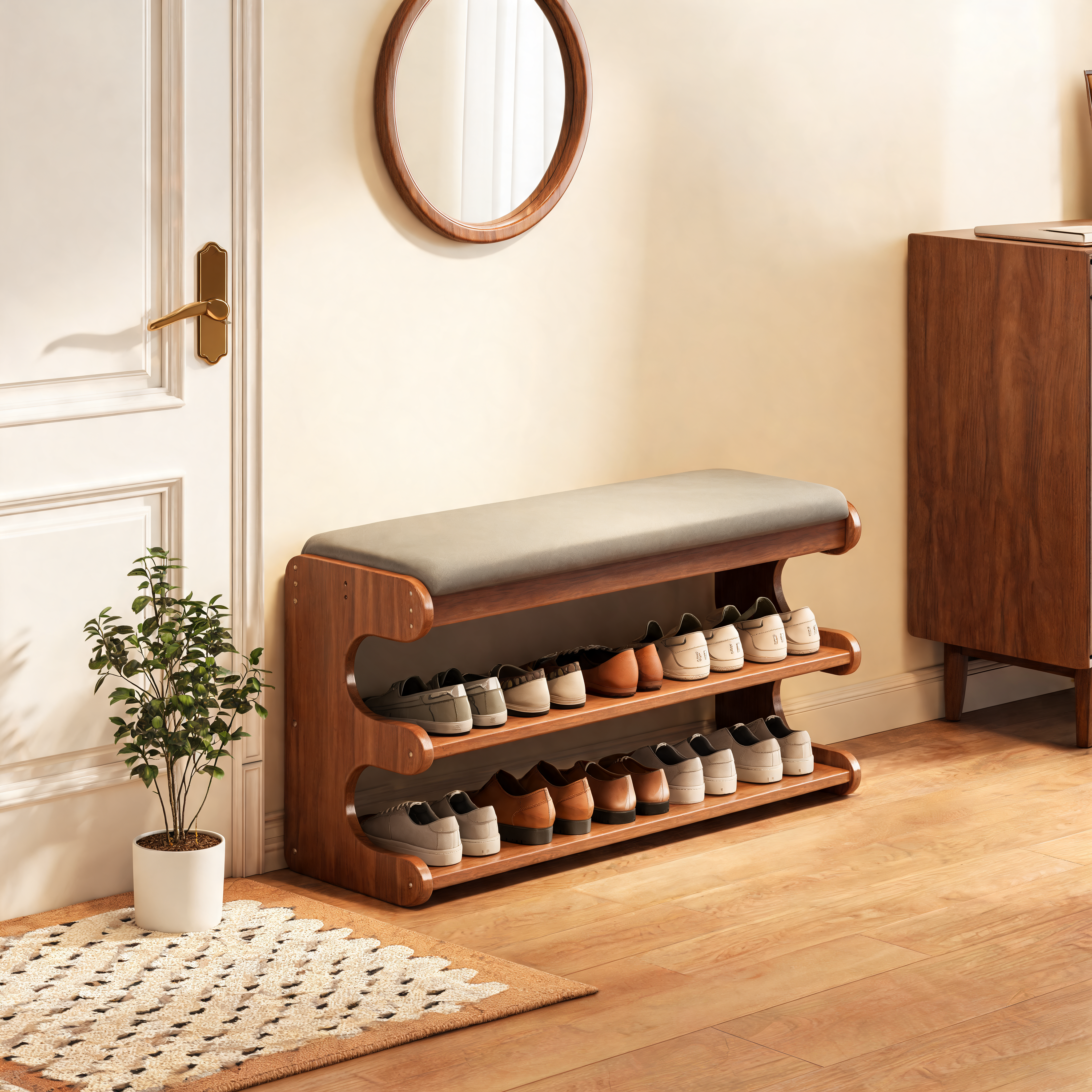 Walnut shoe storage bench with gray cushion seat in a bright entryway