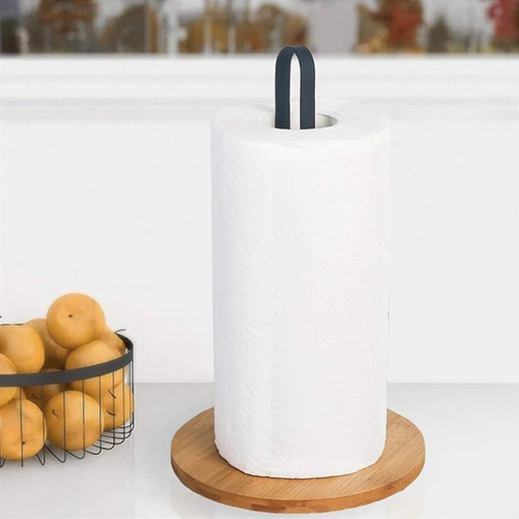 Paper towel holder beside a bowl of oranges