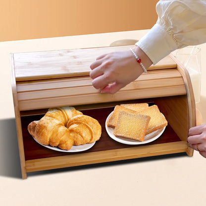 Opening the roll-top door of the bamboo bread box