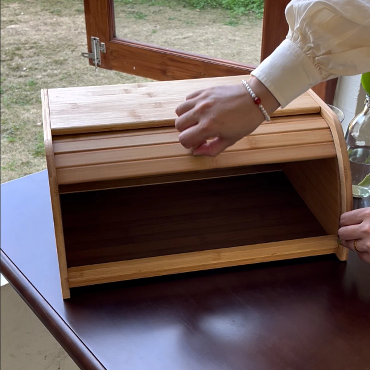 Bamboo bread box on a table