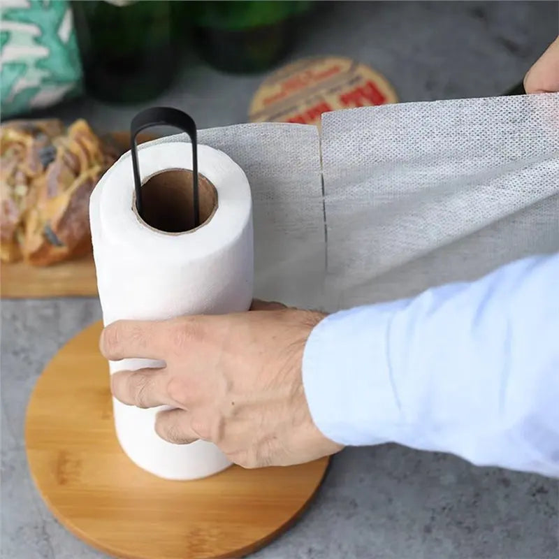 Sliding a paper towel roll onto the holder