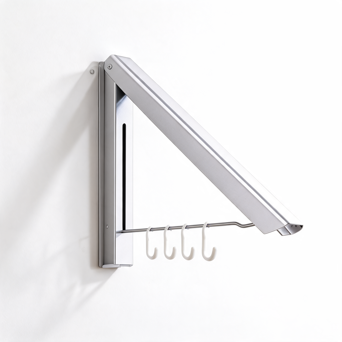 Silver wall-mounted folding drying rack with four white hooks on a white background