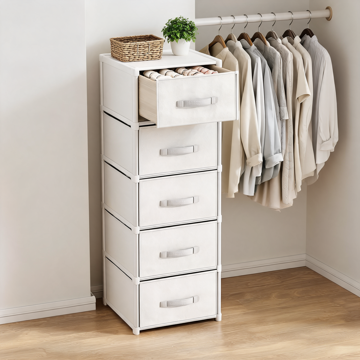 White 5-drawer fabric storage tower in a walk-in closet with folded socks in the top drawer
