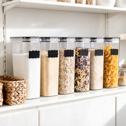 Clear airtight pantry containers filled with pasta, rice and cereal on a shelf