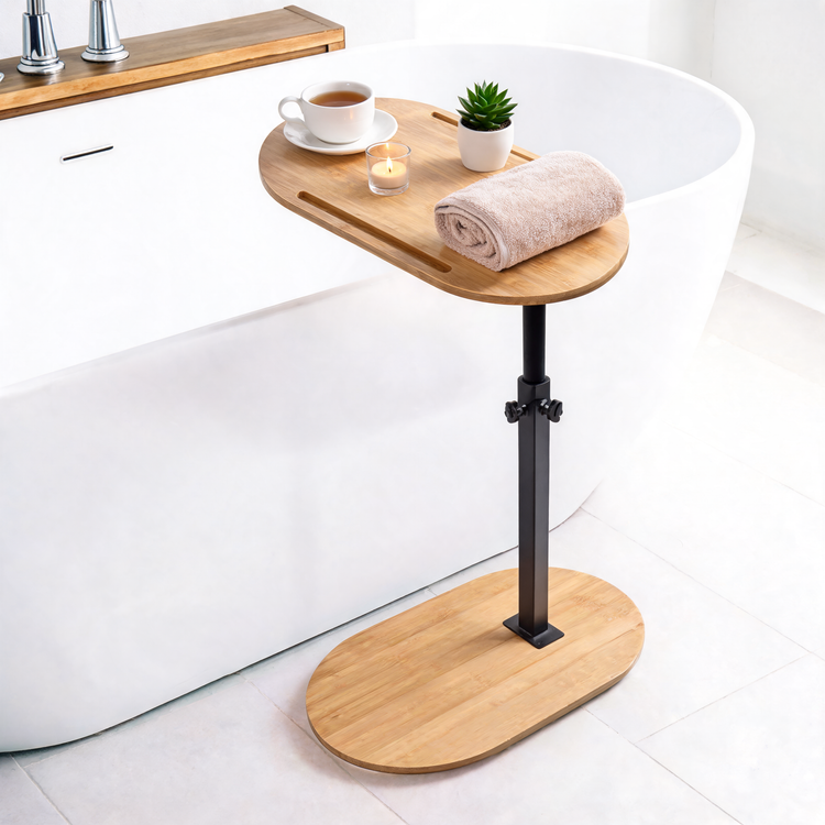 Height-adjustable bamboo side table beside a freestanding bathtub