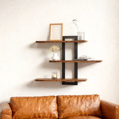 3-tier wall shelf with black frame above a leather sofa