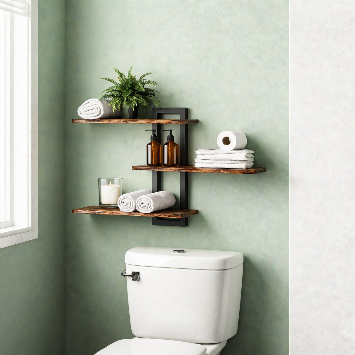 3-tier wall shelf holding towels and plants above a toilet